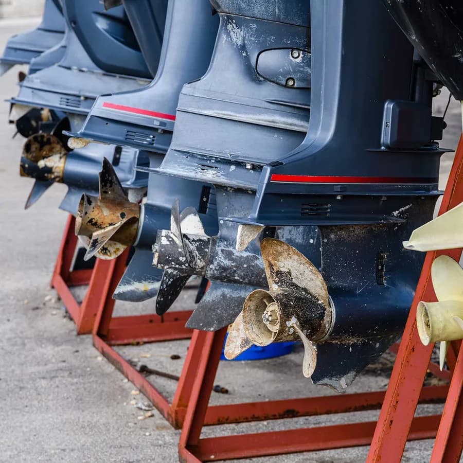 Non-running outboard lower units stored on a rack