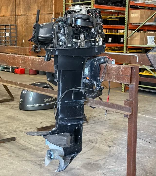 Outboard motor on a workshop stand ready for review